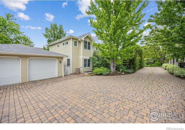 1509 Poplar Ave, Boulder, CO 80304 - view of front of home with decorative driveway and a garage