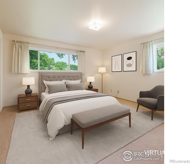 912 Diana St, Fort Morgan, CO 80701 - carpeted bedroom featuring multiple windows