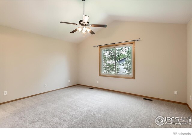 379 E 41st Ct, Loveland, CO 80538 - carpeted spare room with ceiling fan, baseboards, and vaulted ceiling