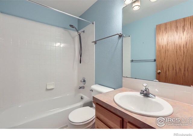 379 E 41st Ct, Loveland, CO 80538 - full bath with vanity, shower / washtub combination, toilet, and a textured wall