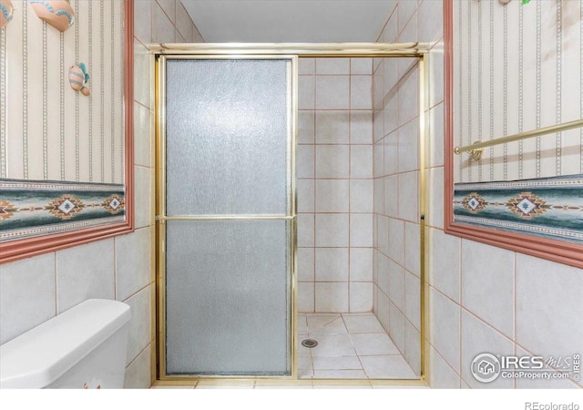 1365 Settlers Dr, Eaton, CO 80615 - bathroom with a stall shower and tile walls