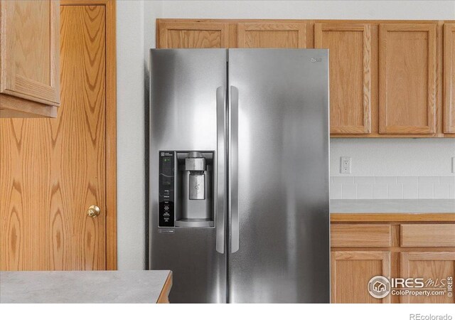 1365 Settlers Dr, Eaton, CO 80615 - kitchen featuring stainless steel refrigerator with ice dispenser and light countertops