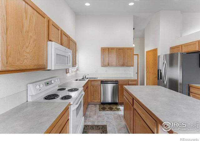 1365 Settlers Dr, Eaton, CO 80615 - kitchen featuring appliances with stainless steel finishes, light countertops, and recessed lighting