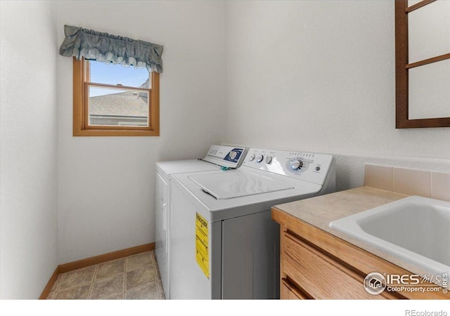 1365 Settlers Dr, Eaton, CO 80615 - washroom with cabinet space and separate washer and dryer