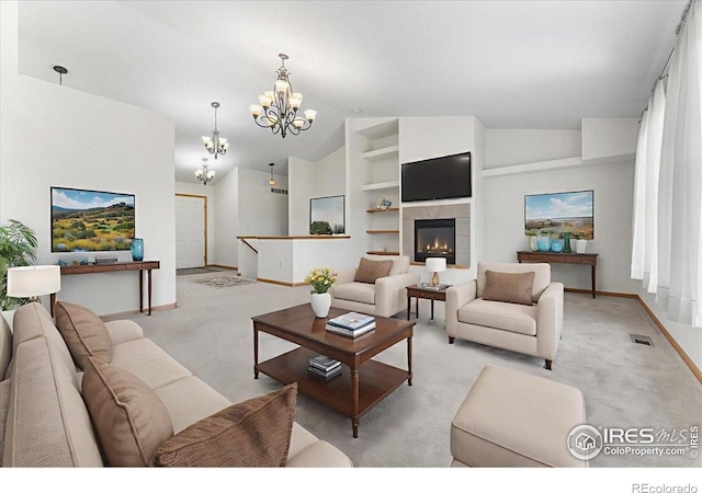 1365 Settlers Dr, Eaton, CO 80615 - living area featuring a chandelier, light colored carpet, lofted ceiling, a fireplace, and built in features