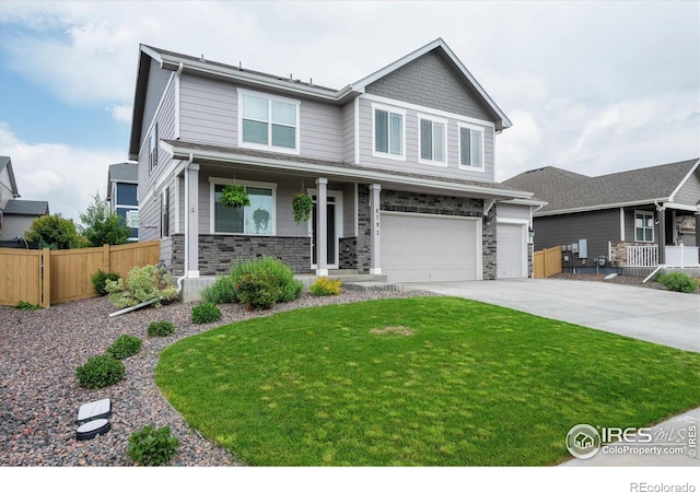 6793 Hayfield St, Wellington, CO 80549 - craftsman-style home featuring a porch, a garage, stone siding, and concrete driveway