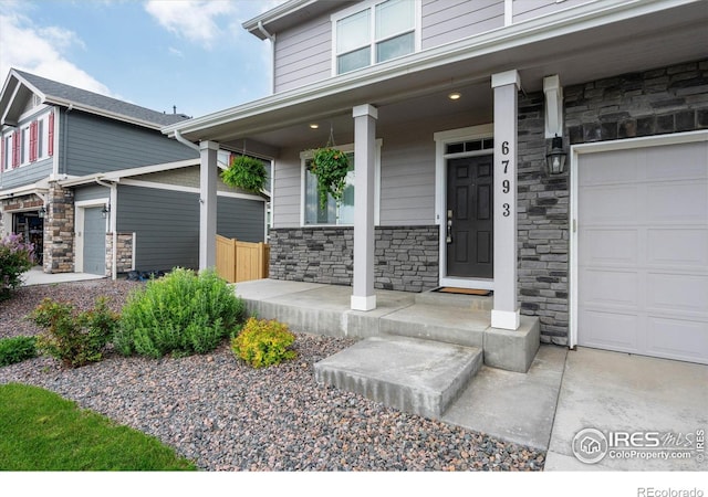 6793 Hayfield St, Wellington, CO 80549 - entrance to property featuring stone siding and covered porch