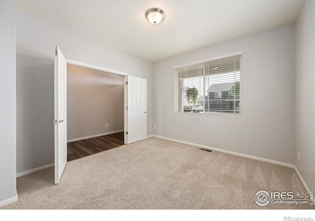 6793 Hayfield St, Wellington, CO 80549 - empty room with carpet flooring and baseboards