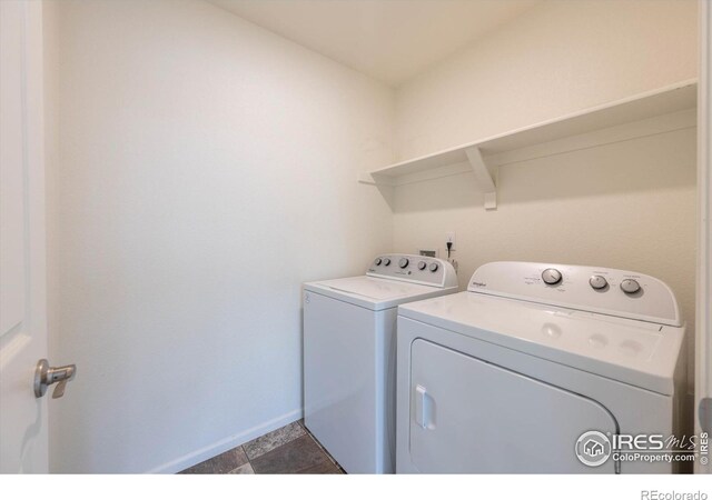 6793 Hayfield St, Wellington, CO 80549 - laundry room featuring washing machine and dryer and baseboards
