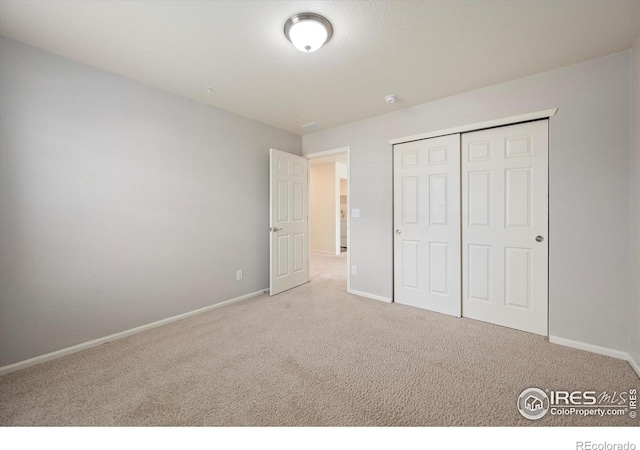 6793 Hayfield St, Wellington, CO 80549 - unfurnished bedroom with carpet, baseboards, and a closet