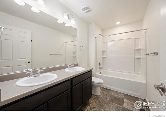 6793 Hayfield St, Wellington, CO 80549 - bathroom with toilet, double vanity, washtub / shower combination, and stone finish floors