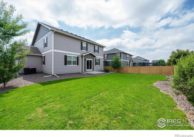 6793 Hayfield St, Wellington, CO 80549 - back of house with a patio area