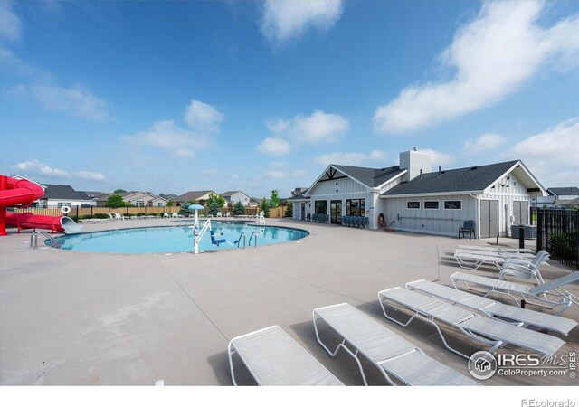 6793 Hayfield St, Wellington, CO 80549 - community pool with a patio and a water slide