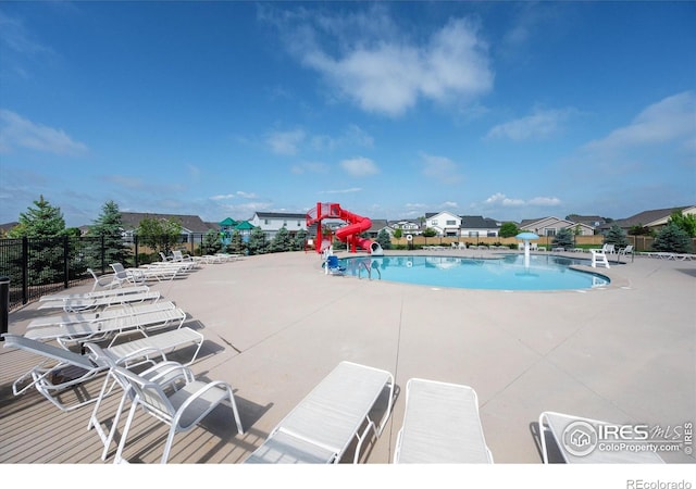 6793 Hayfield St, Wellington, CO 80549 - community pool featuring a patio and a residential view