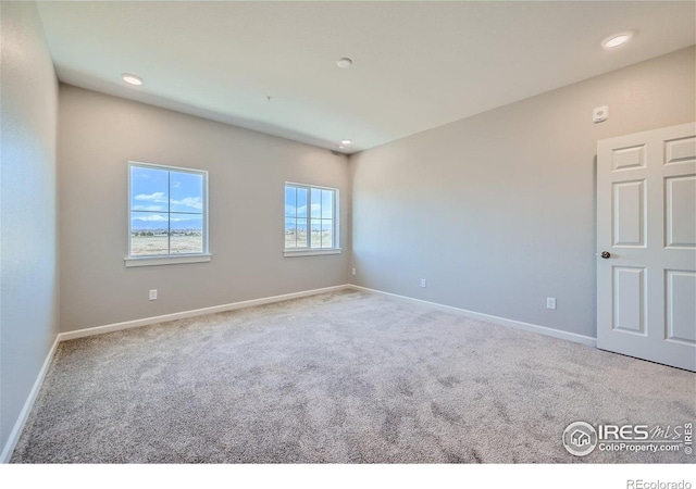 2435 Calais Dr Unit G, Longmont, CO 80504 - carpeted empty room featuring baseboards and recessed lighting