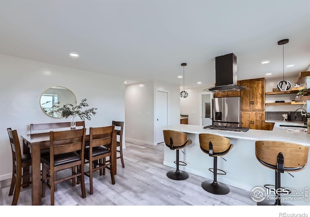 128 Carpenter Rd, Fort Collins, CO 80525 - kitchen with appliances with stainless steel finishes, island exhaust hood, open shelves, light countertops, and a sink