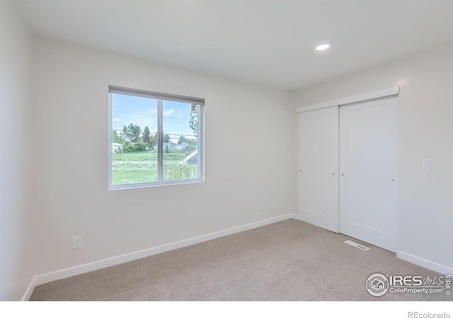 128 Carpenter Rd, Fort Collins, CO 80525 - unfurnished bedroom featuring carpet flooring, recessed lighting, baseboards, and a closet