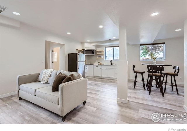 128 Carpenter Rd, Fort Collins, CO 80525 - living area featuring light wood-style flooring, baseboards, and recessed lighting