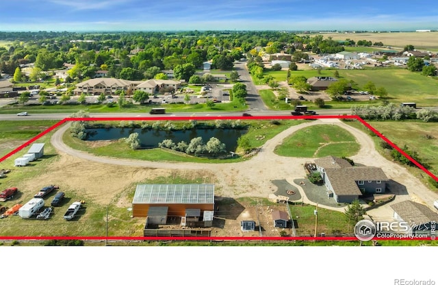128 Carpenter Rd, Fort Collins, CO 80525 - aerial perspective of suburban area with property boundaries highlighted and a large body of water