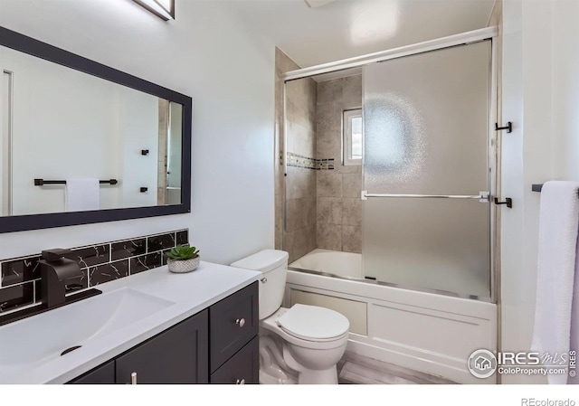 128 Carpenter Rd, Fort Collins, CO 80525 - full bath featuring vanity, toilet, and shower / bath combination with glass door