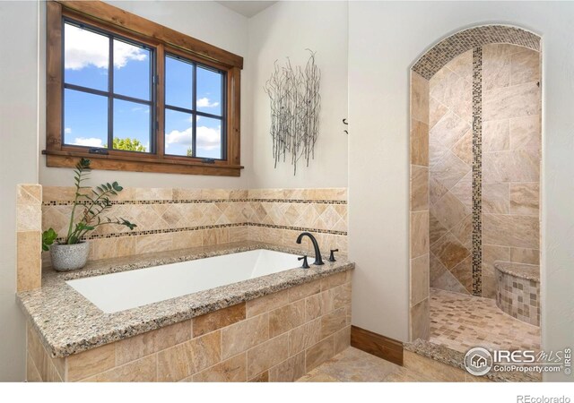 5709 Old Legacy Dr, Fort Collins, CO 80528 - full bathroom featuring a garden tub and tiled shower