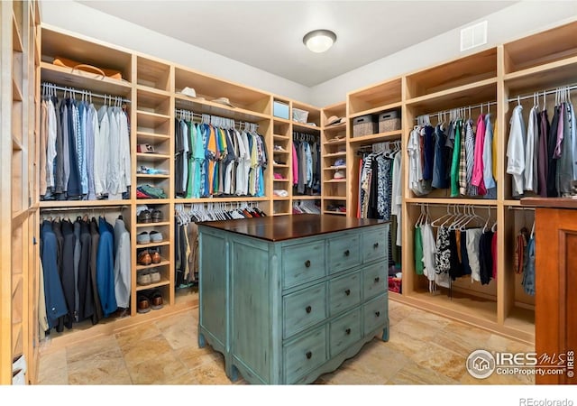 5709 Old Legacy Dr, Fort Collins, CO 80528 - walk in closet featuring stone finish flooring