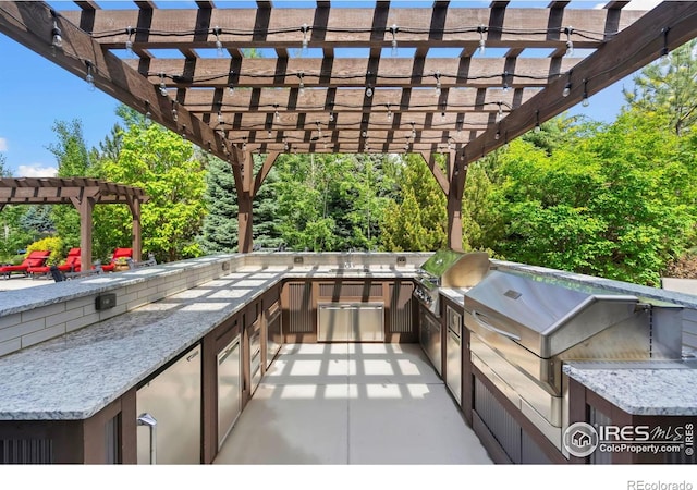 5709 Old Legacy Dr, Fort Collins, CO 80528 - view of patio with a pergola and area for grilling