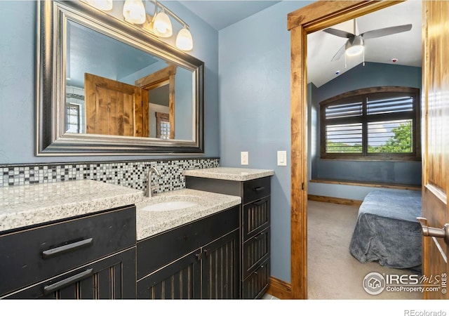 5709 Old Legacy Dr, Fort Collins, CO 80528 - bathroom featuring vanity, ceiling fan, decorative backsplash, and vaulted ceiling