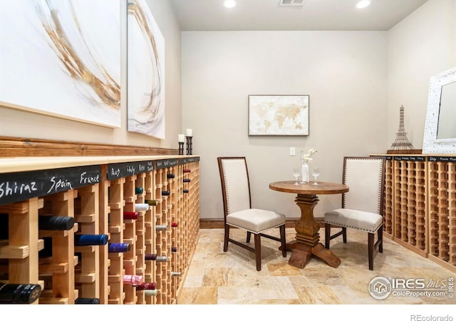 5709 Old Legacy Dr, Fort Collins, CO 80528 - wine cellar featuring stone finish floors and recessed lighting