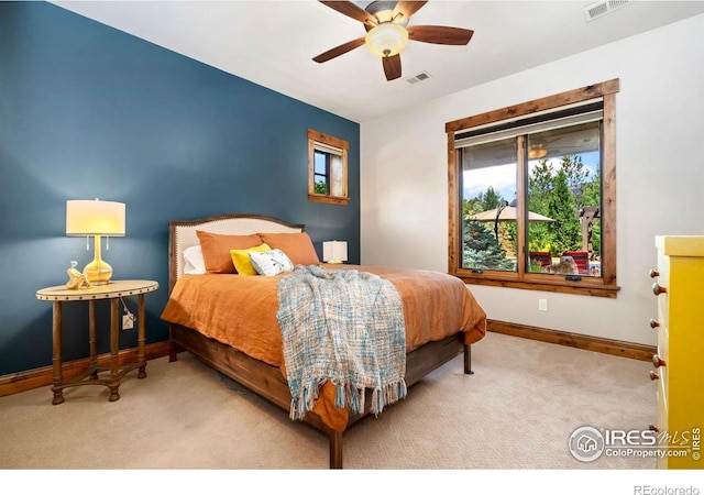 5709 Old Legacy Dr, Fort Collins, CO 80528 - carpeted bedroom with multiple windows and ceiling fan