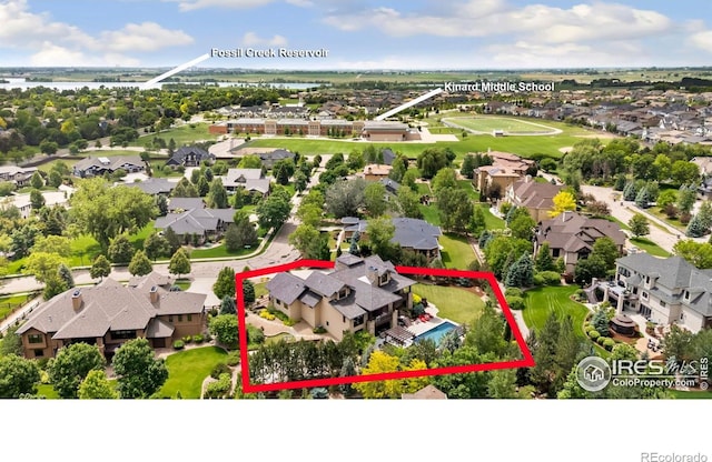 5709 Old Legacy Dr, Fort Collins, CO 80528 - aerial view of residential area featuring a nearby body of water and property boundaries highlighted