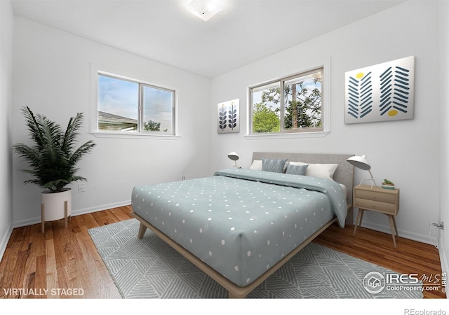 4462 Hamilton Ct, Boulder, CO 80305 - bedroom featuring wood finished floors and baseboards