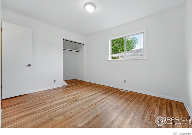 4462 Hamilton Ct, Boulder, CO 80305 - unfurnished bedroom with light wood finished floors, baseboards, and a closet