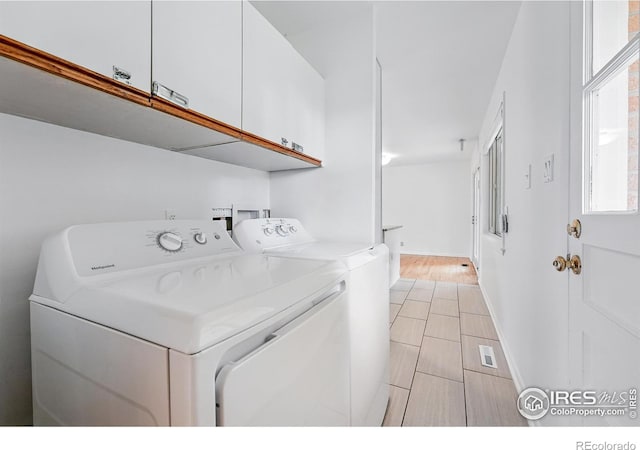 4462 Hamilton Ct, Boulder, CO 80305 - laundry area featuring cabinet space and washing machine and clothes dryer