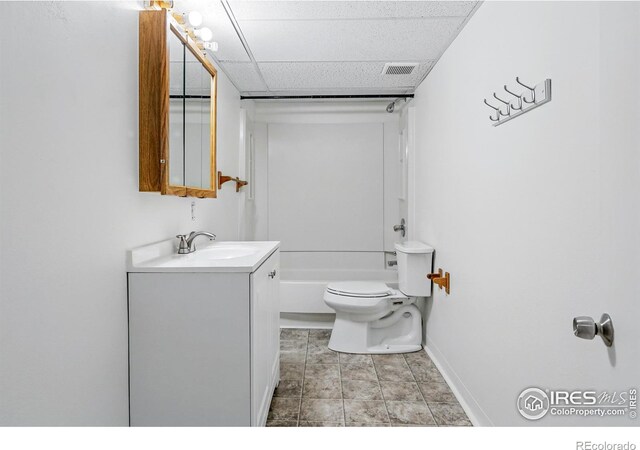 4462 Hamilton Ct, Boulder, CO 80305 - bathroom featuring vanity, toilet, baseboards, a paneled ceiling, and shower / bathtub combination