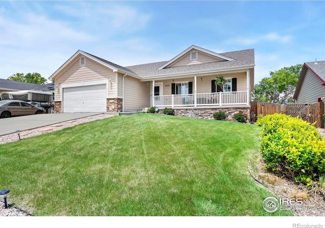 2609 Wharf St, Evans, CO 80620 - single story home with a porch, stone siding, concrete driveway, a shingled roof, and an attached garage