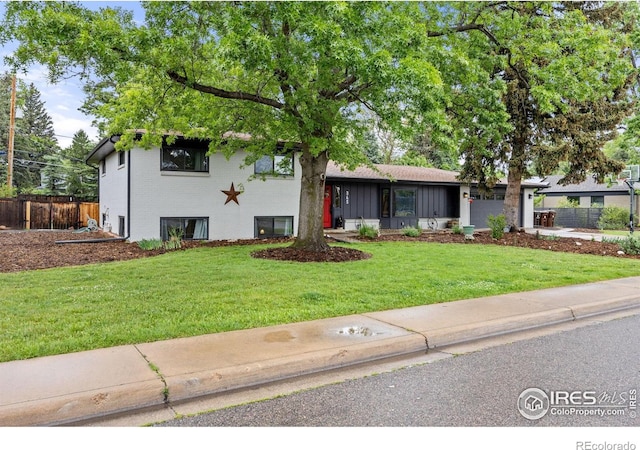 365 Mohawk Dr, Boulder, CO 80303 - split level home with brick siding and an attached garage