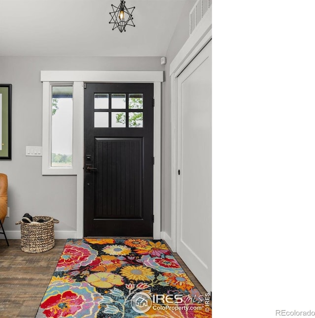 365 Mohawk Dr, Boulder, CO 80303 - entryway featuring wood finished floors, baseboards, and lofted ceiling