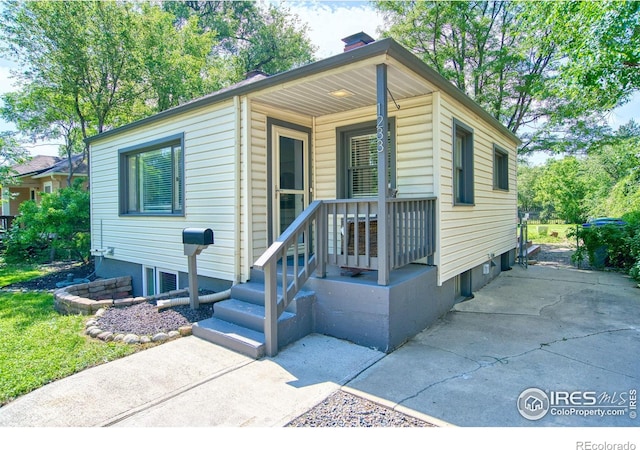 1233 Carolina Ave, Longmont, CO 80501 - view of front of home with a chimney