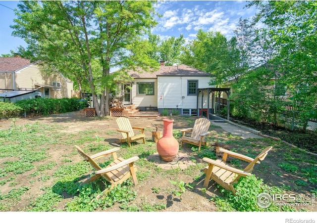 1233 Carolina Ave, Longmont, CO 80501 - view of yard with a fire pit