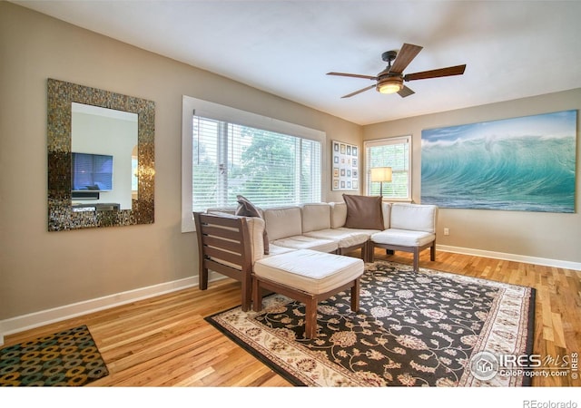 1233 Carolina Ave, Longmont, CO 80501 - living area with wood finished floors, ceiling fan, and baseboards