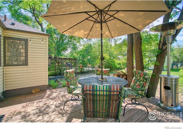 1233 Carolina Ave, Longmont, CO 80501 - wooden terrace featuring outdoor dining area