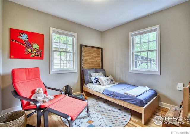 1233 Carolina Ave, Longmont, CO 80501 - bedroom with wood finished floors and baseboards