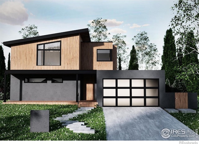 1265 Hartford Dr, Boulder, CO 80305 - contemporary home with concrete driveway, a garage, and stucco siding