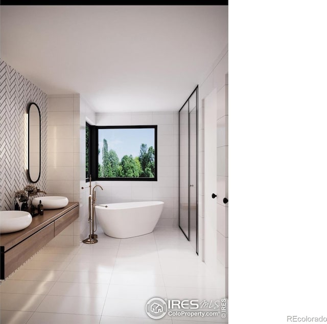 1265 Hartford Dr, Boulder, CO 80305 - full bath featuring tile walls, tile patterned floors, a freestanding tub, and double vanity