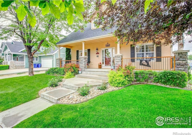 1421 Canal Dr, Windsor, CO 80550 - view of front of home featuring a porch, a front lawn, and a garage