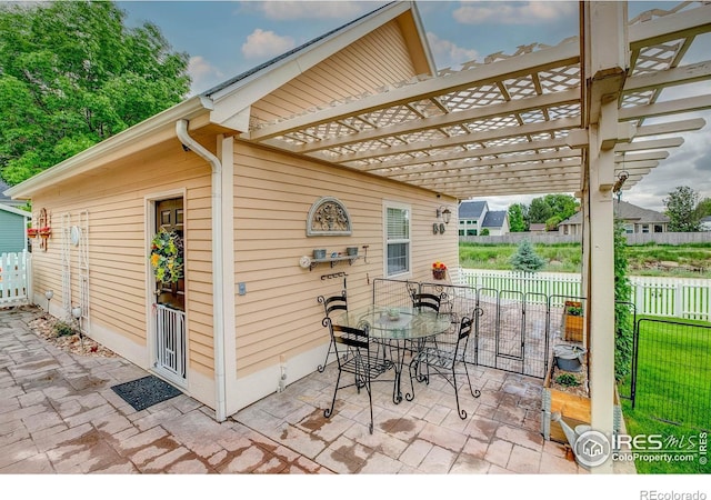 1421 Canal Dr, Windsor, CO 80550 - view of patio with a pergola and outdoor dining space