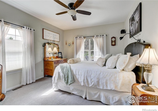 1421 Canal Dr, Windsor, CO 80550 - carpeted bedroom with a ceiling fan and baseboards