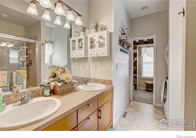 1421 Canal Dr, Windsor, CO 80550 - full bathroom featuring double vanity and a shower stall