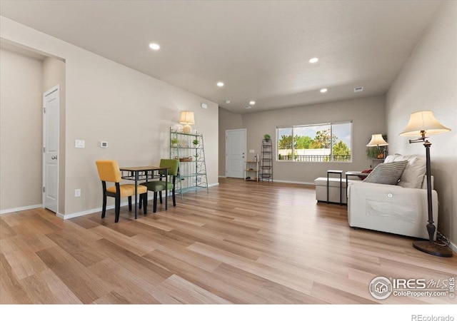 3635 Ronald Reagan Ave, Wellington, CO 80549 - living area with light wood-style floors, recessed lighting, and baseboards